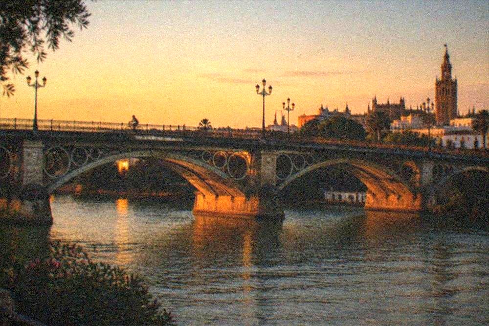 The Puente de Triana over the Guadalquivir River in evening light