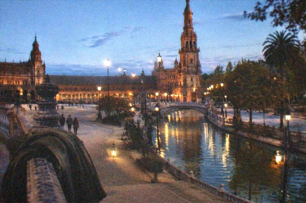 Evening light on the Plaza de España towers seen from the open square