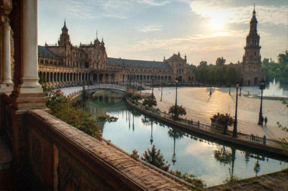 Semicircular building and canal of Plaza de España in Seville in daylight
