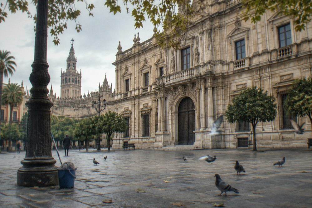 An open plaza in central Seville surrounded by historic buildings