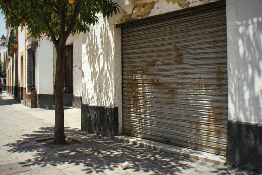 Shuttered front of a closed flamenco venue in Seville