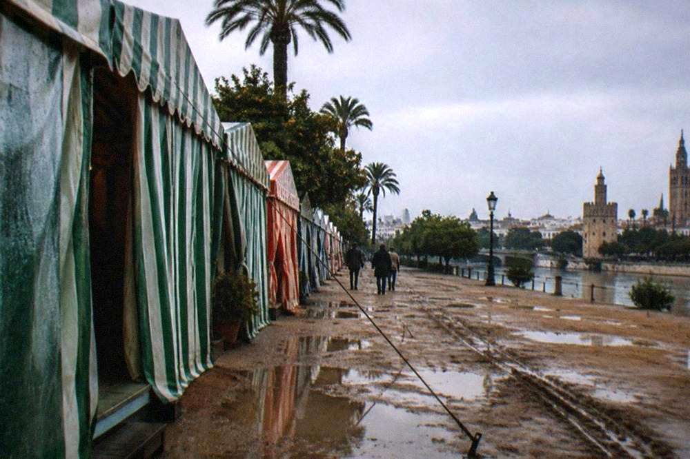 Rows of striped caseta tents at a fairground in Seville