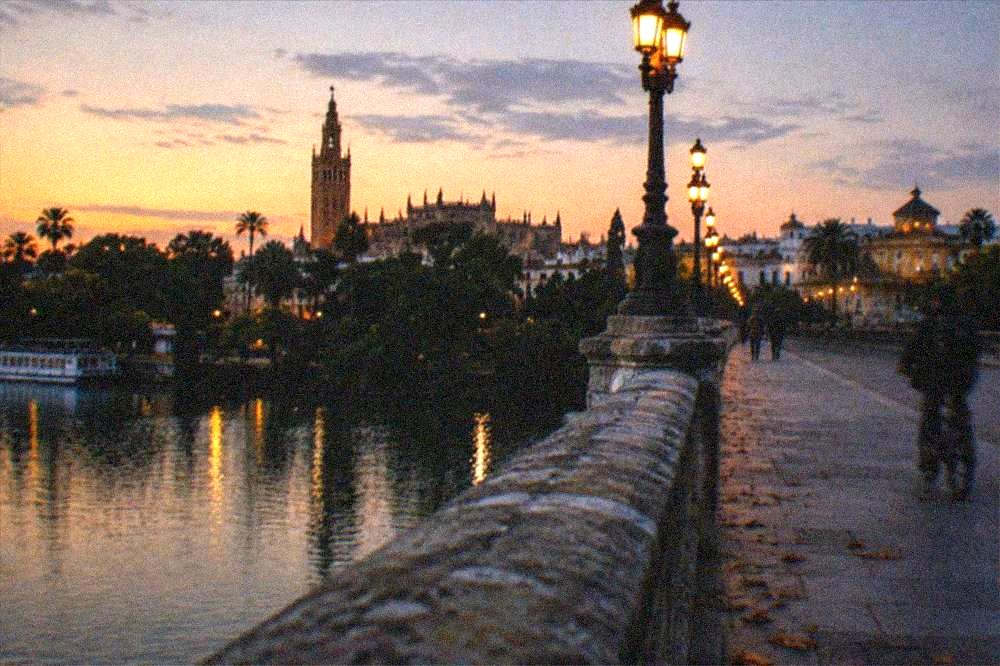 The Triana bridge over the Guadalquivir River at dusk