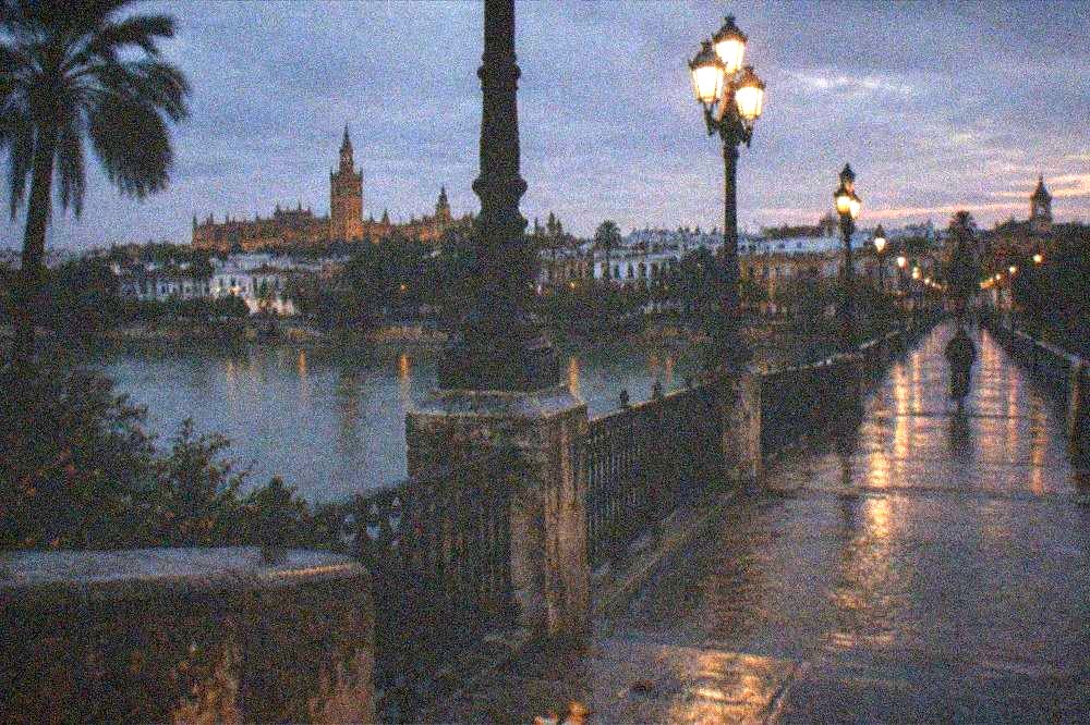 The Triana bridge over the Guadalquivir River at dusk