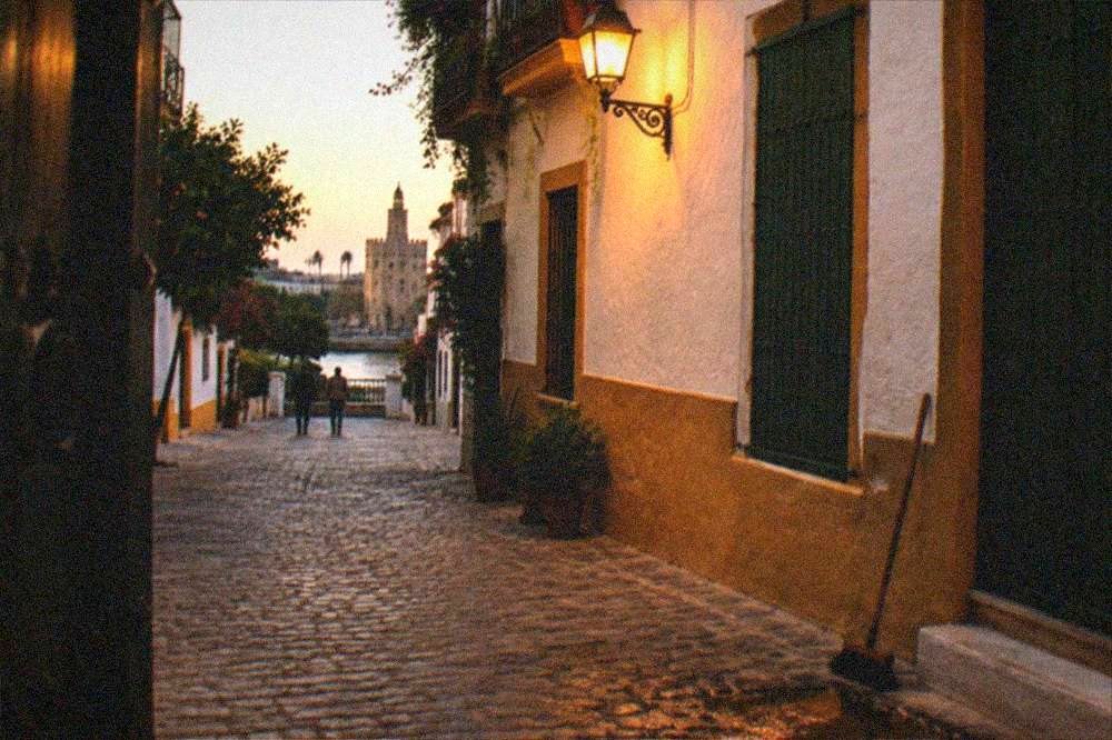 Evening light on a Triana street with shuttered windows